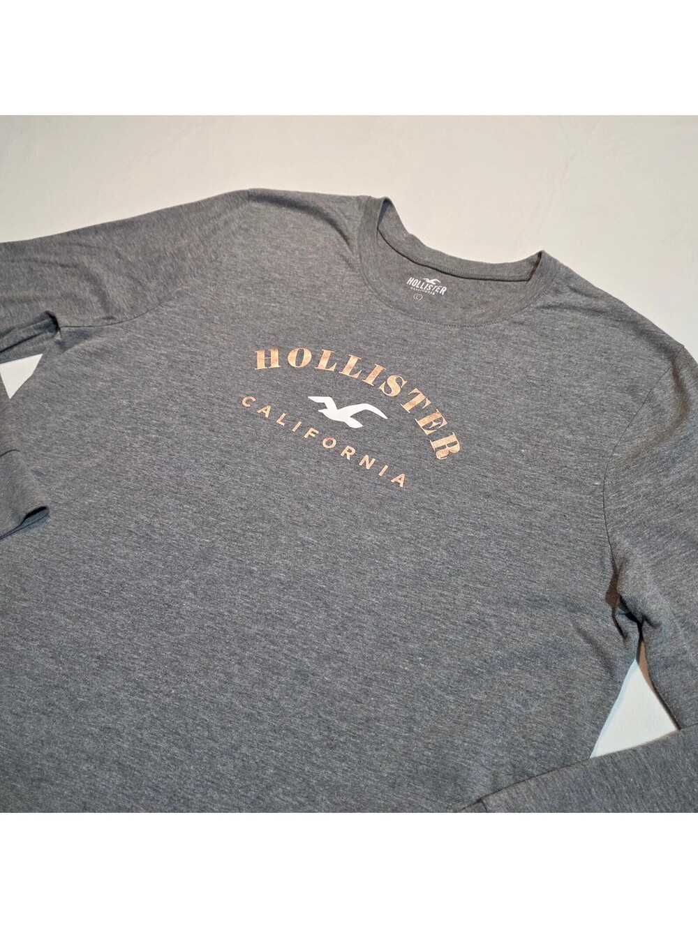 Hollister Long Sleeve gray heathered with Rose Gold & White graphic size Large